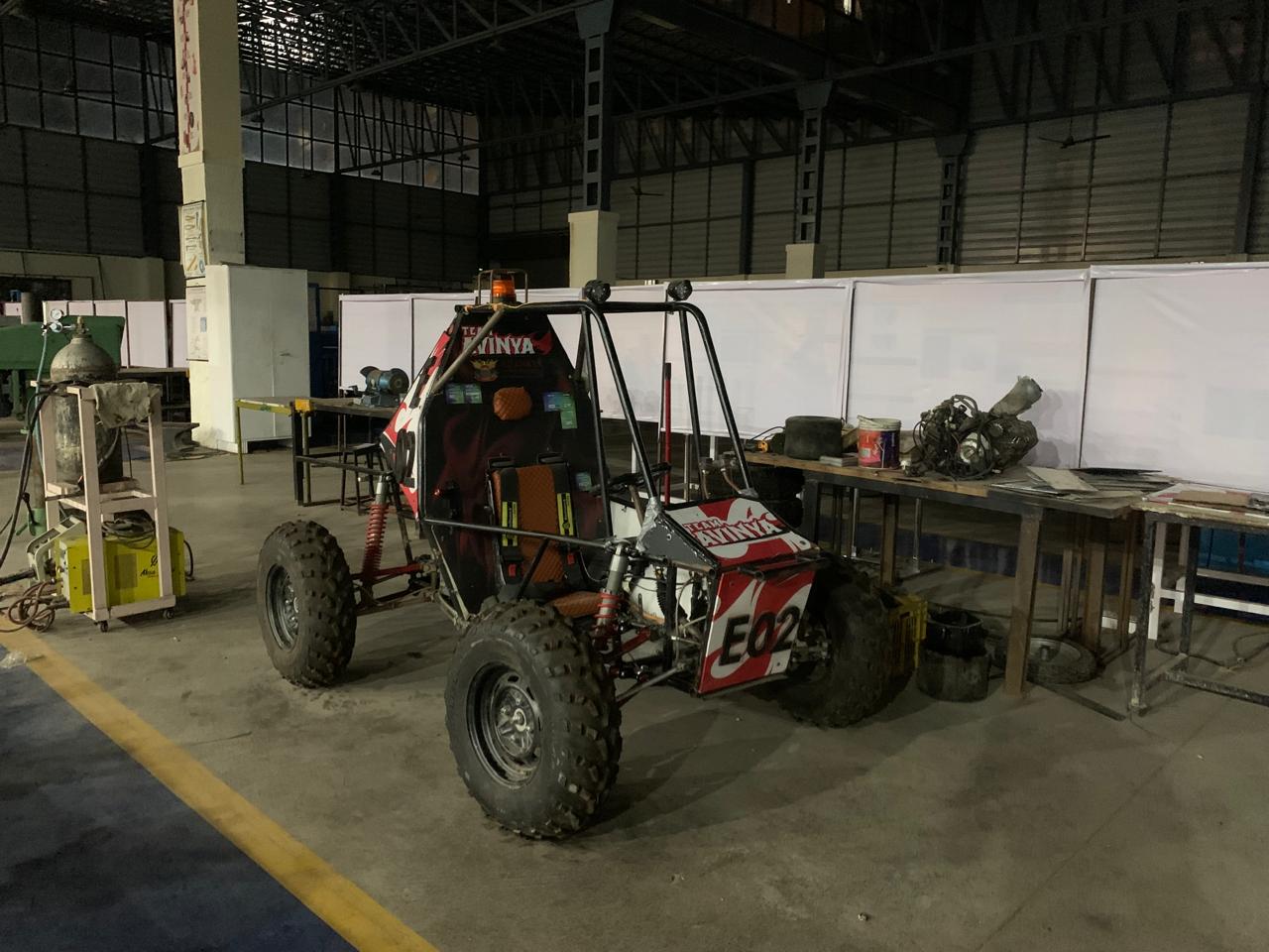 Team Avinya electric ATV securely stored in ADYPU workshop